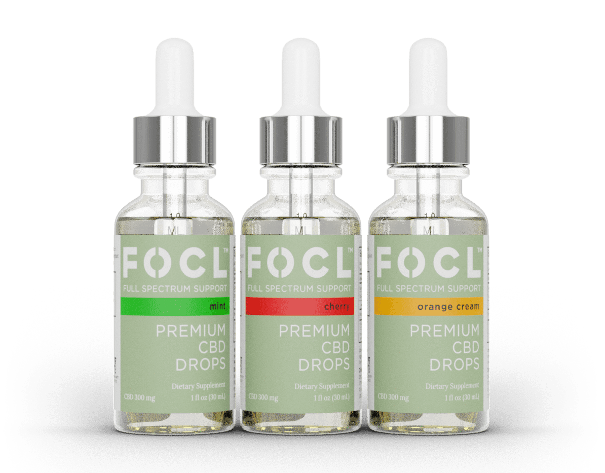 three FOCL full-spectrum CBD oil drops in mint, cherry, and orange cream