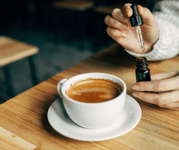 cbd oil drops into coffee