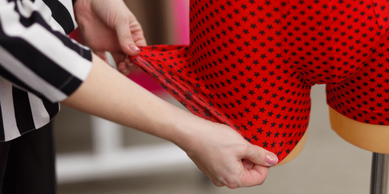 woman looking at red men's underwear boxer briefs with stars