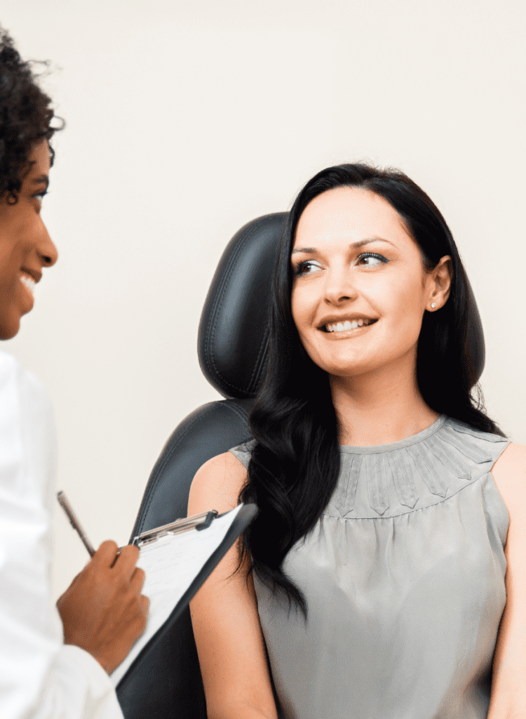 black eye doctor talk to female patient about vision in medical checkup