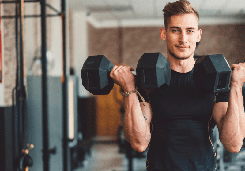 young man weight lifting higher testosterone