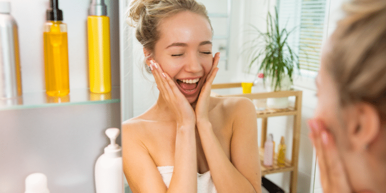 young woman is excited after applying cbd moisturizer to her face in the spa