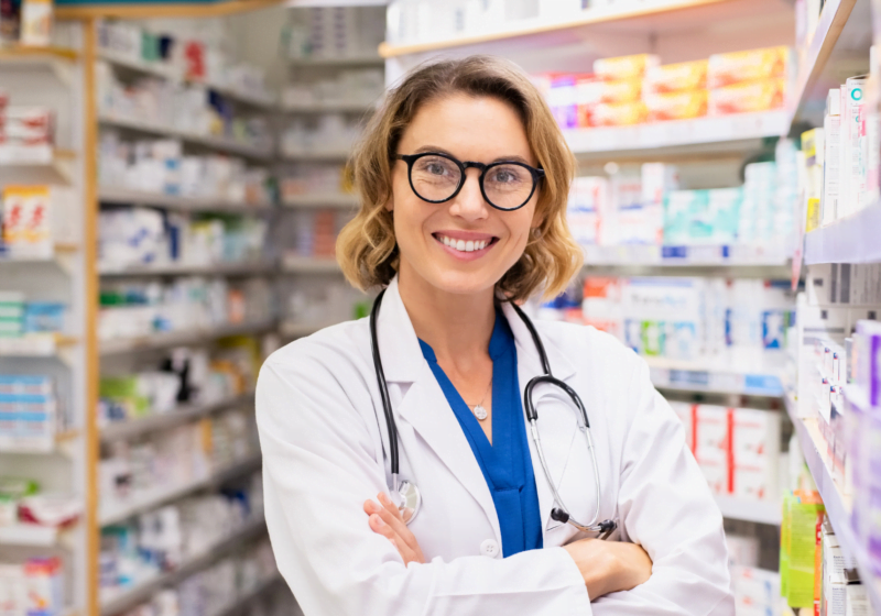 young female pharmacist with glasses ready to help patients with chronic conditions