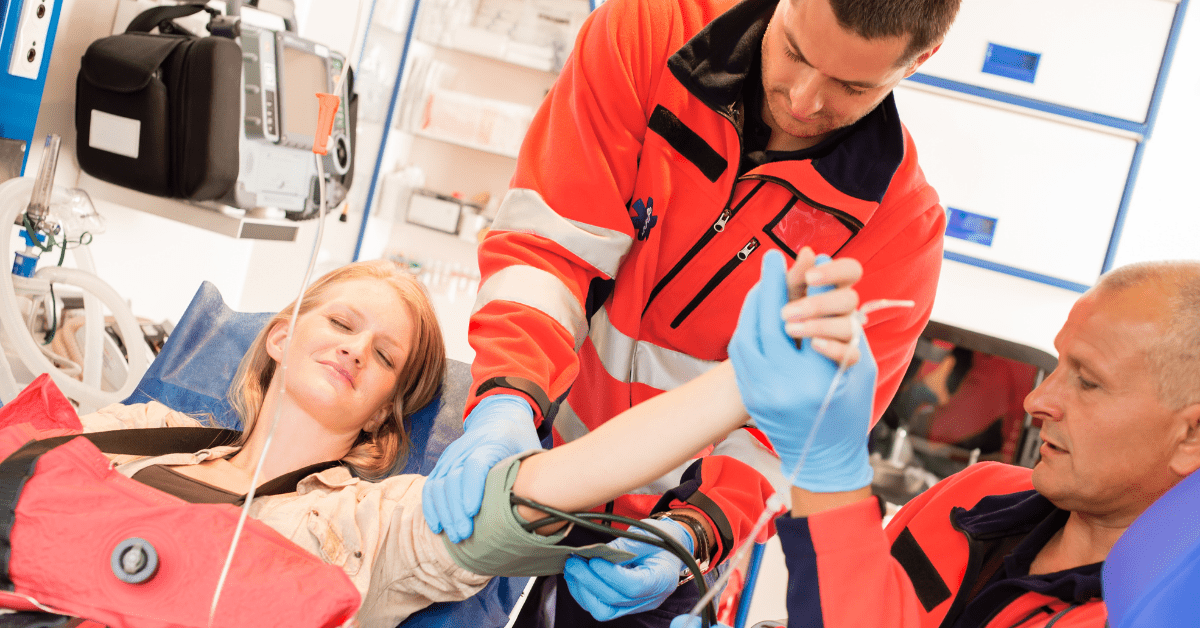 woman in ambulance emt reading mobile app