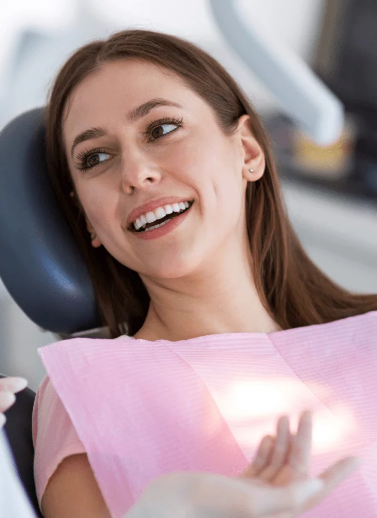 woman happy looking at her new smile at the dentist