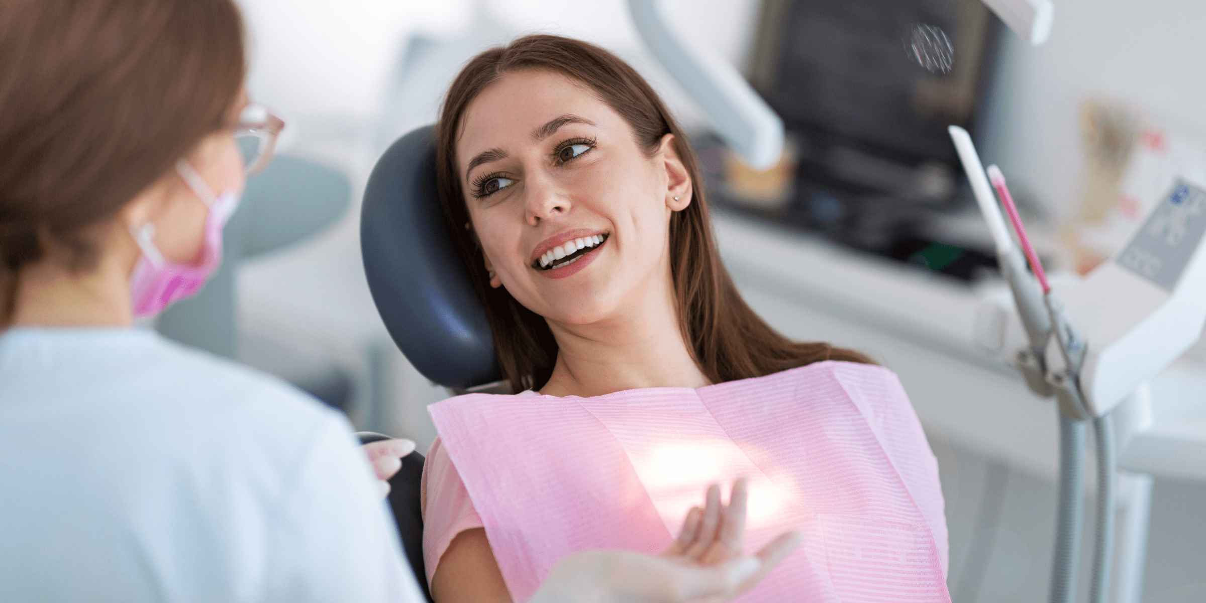 woman happy looking at her new smile at the dentist