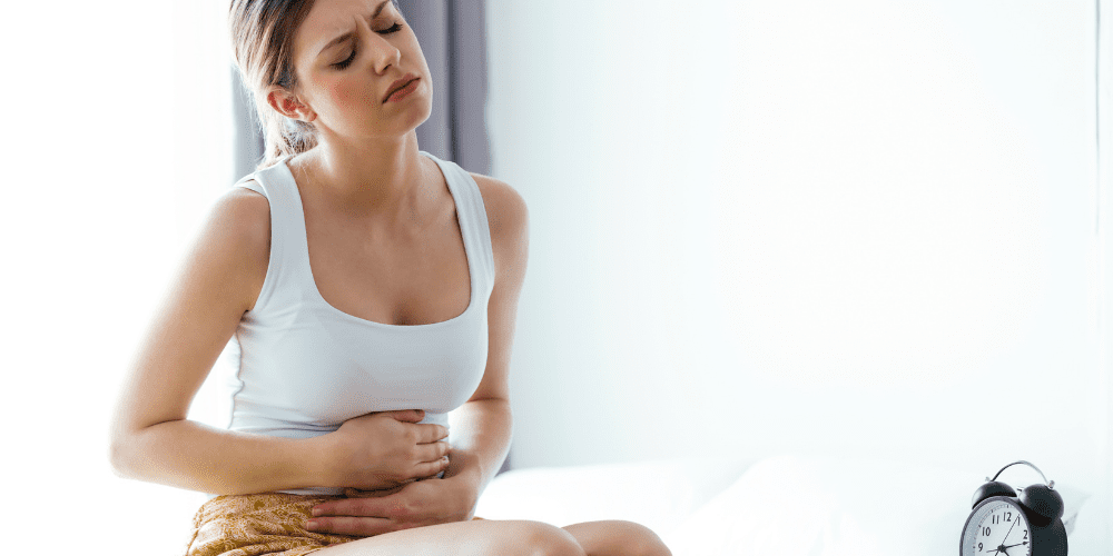 woman with severe stomach pain needs weed