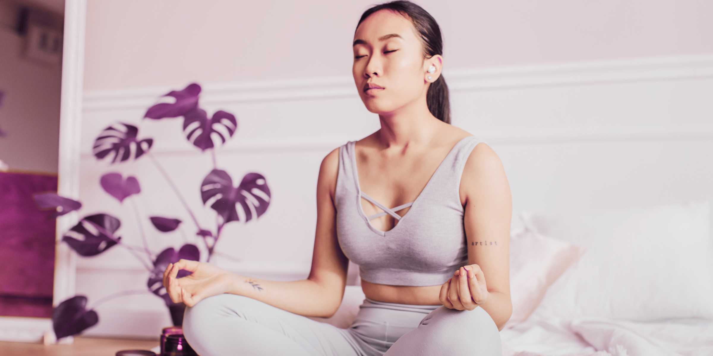 young asian woman in bedroom meditating for stress and more youthful appearance