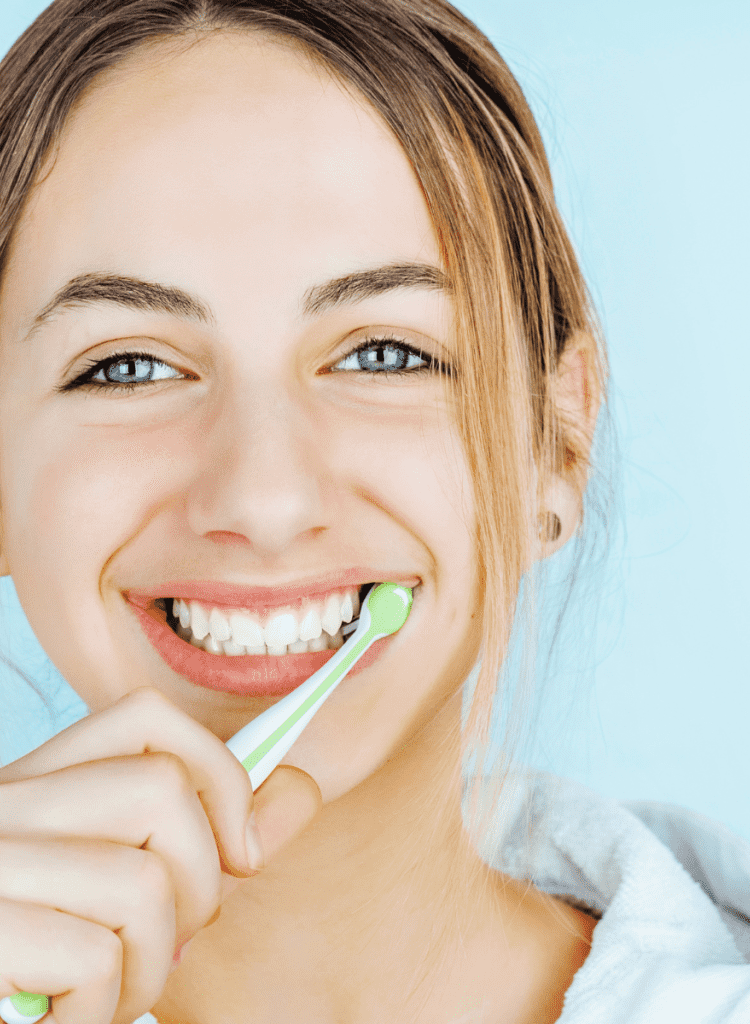 young woman brushing teeth healthy hygiene oral health