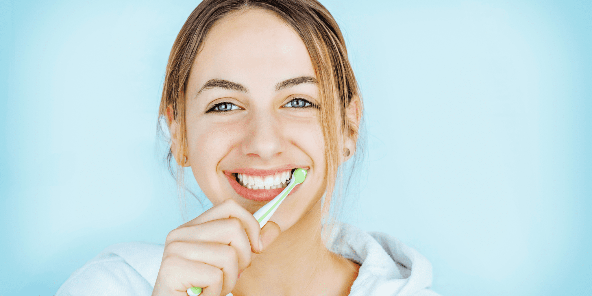 young woman brushing teeth healthy hygiene oral health