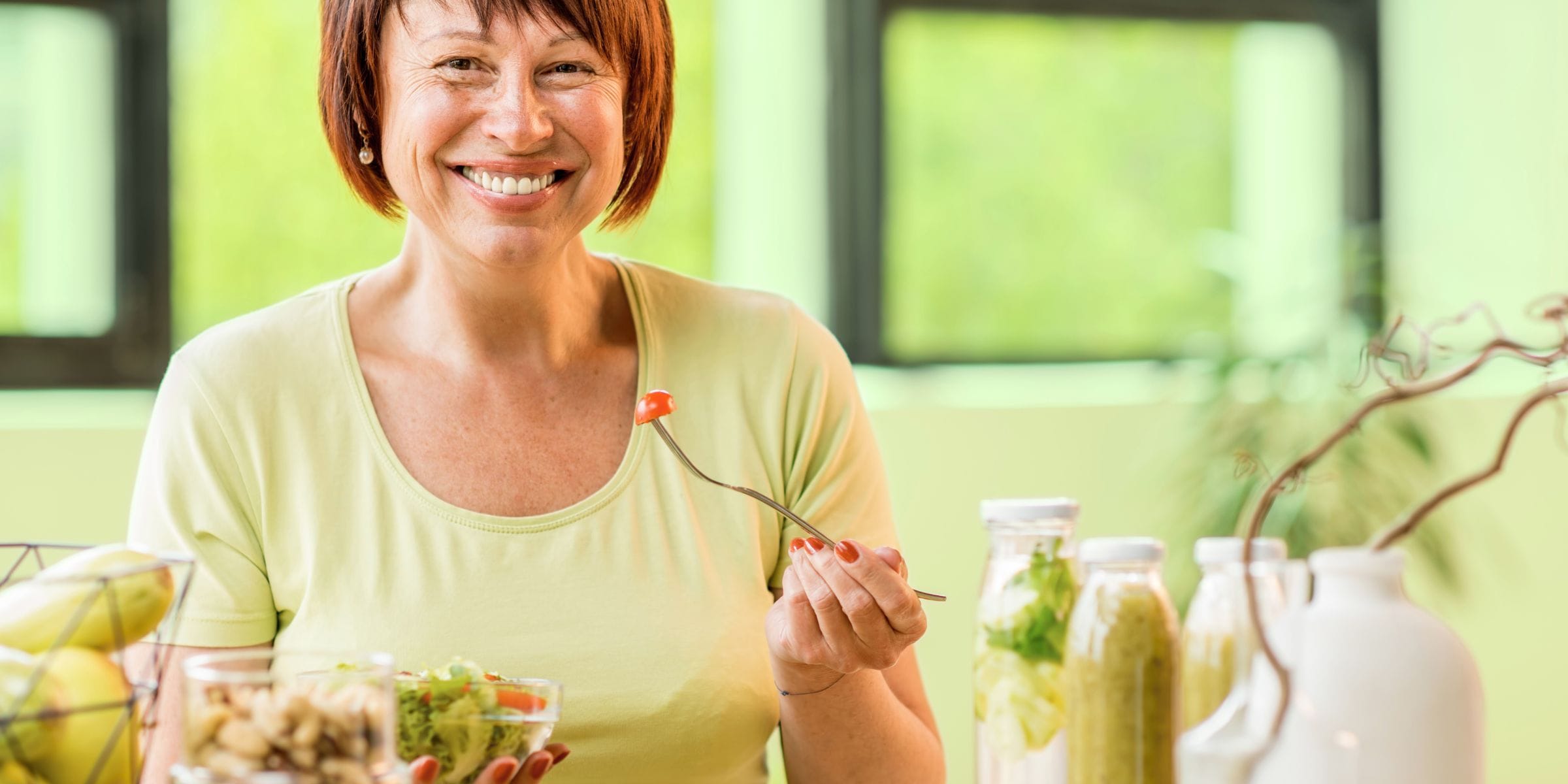 older woman eating a healthy salad