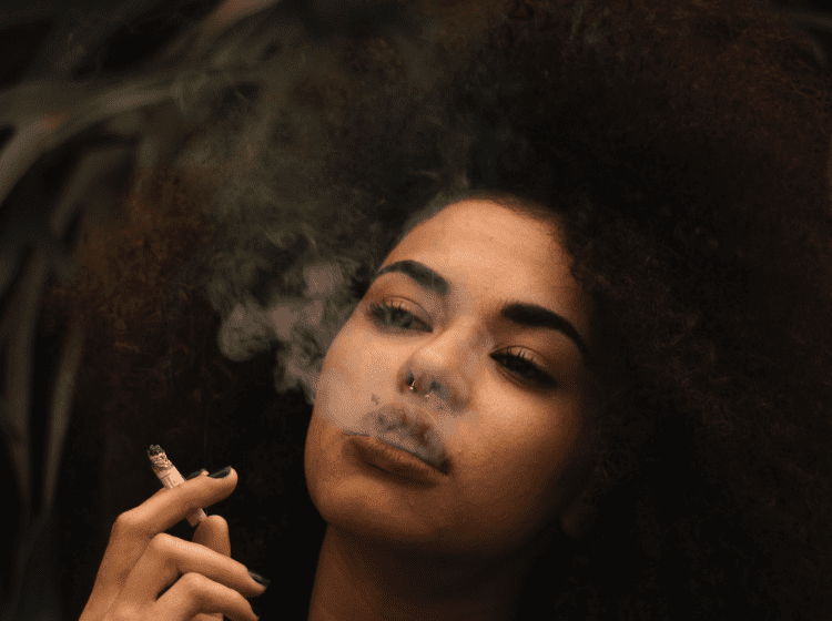 young black woman smoking herbal joint