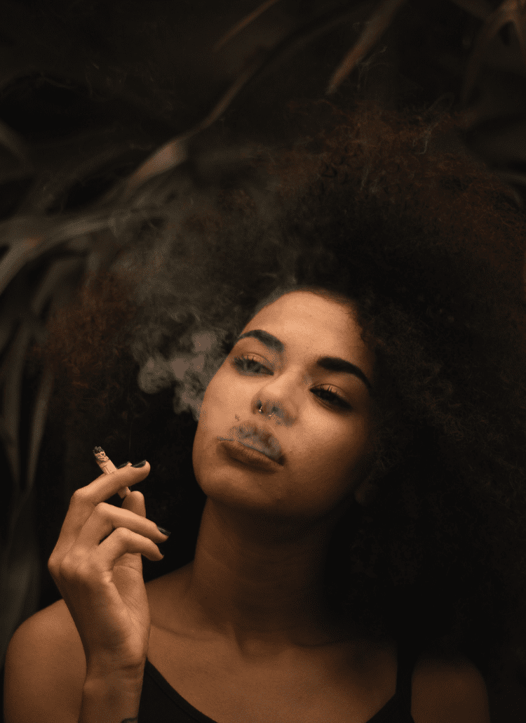 young black woman smoking herbal joint