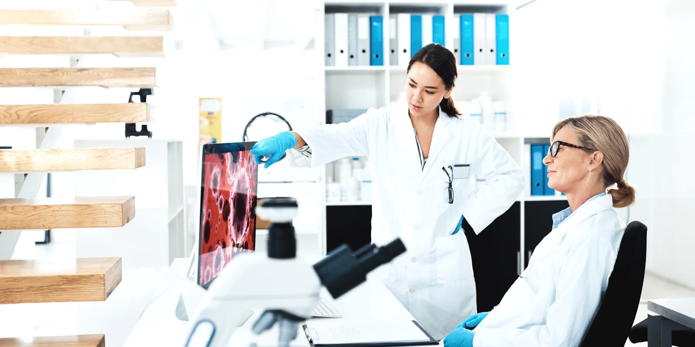 woman scientist explaining results of clinical trial to doctor