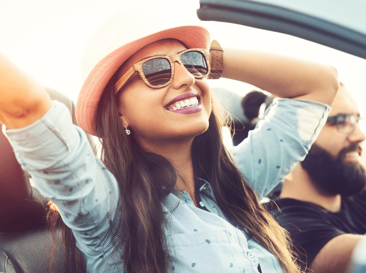 woman happy on road trip with her boyfriend