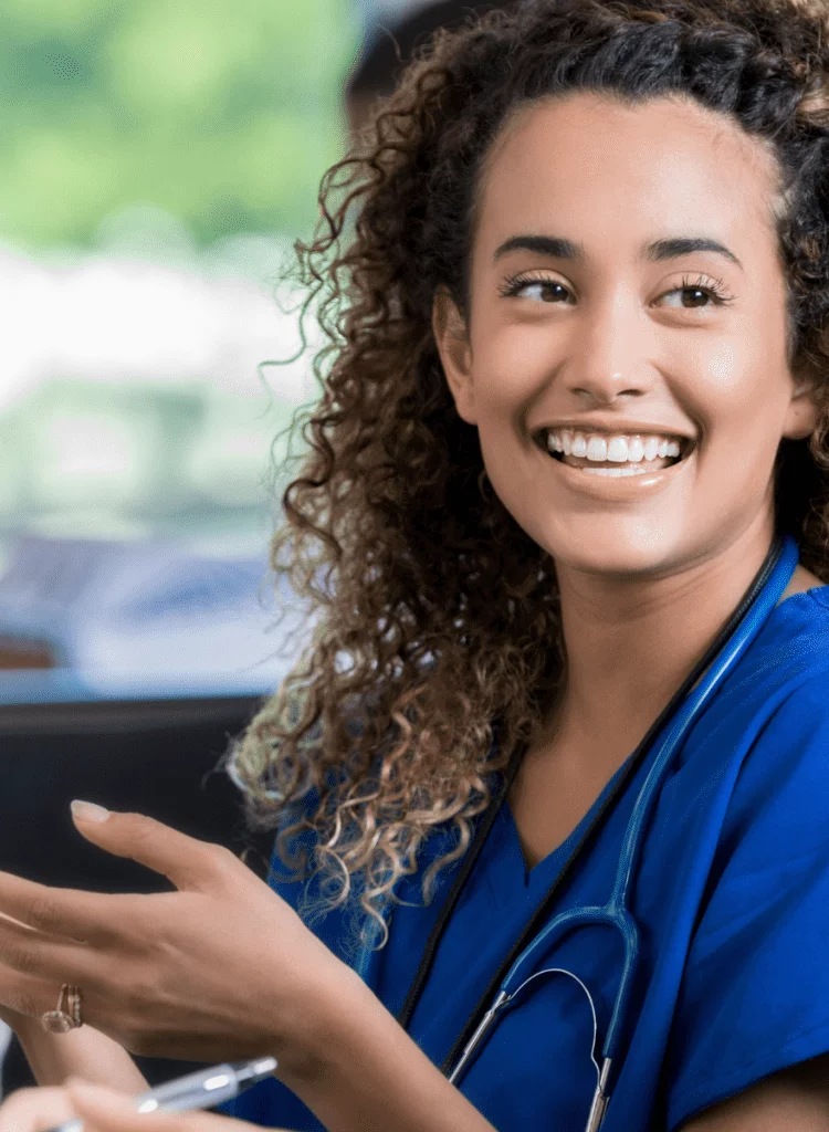 young woman studying to be a nurse talking to a medical student