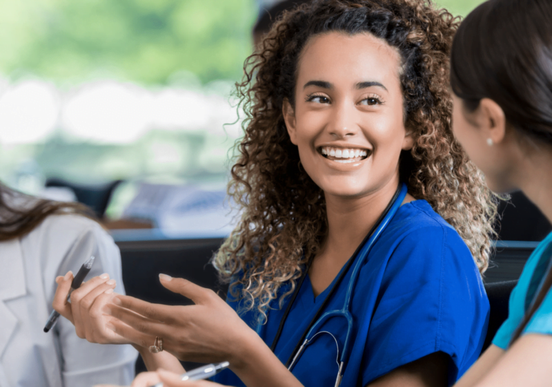 young woman studying to be a nurse talking to a medical student