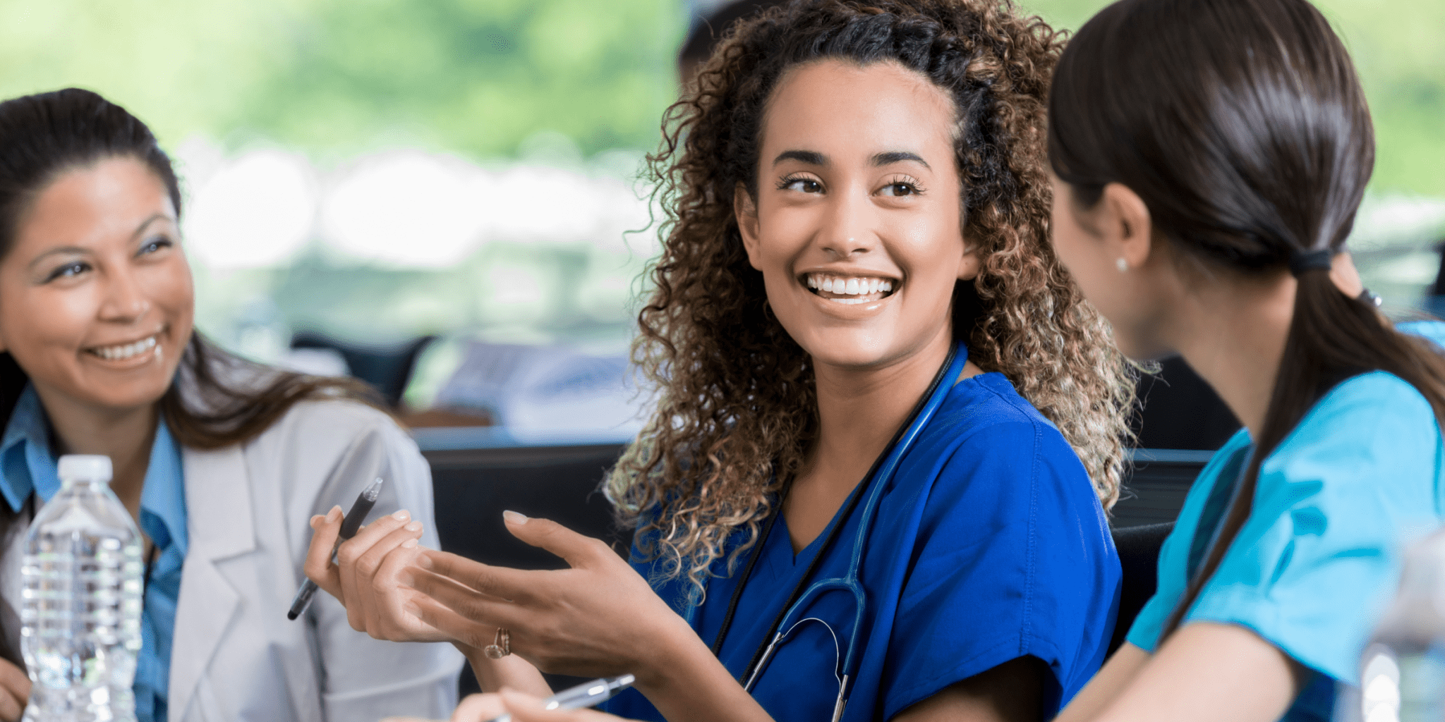 young woman studying to be a nurse talking to a medical student