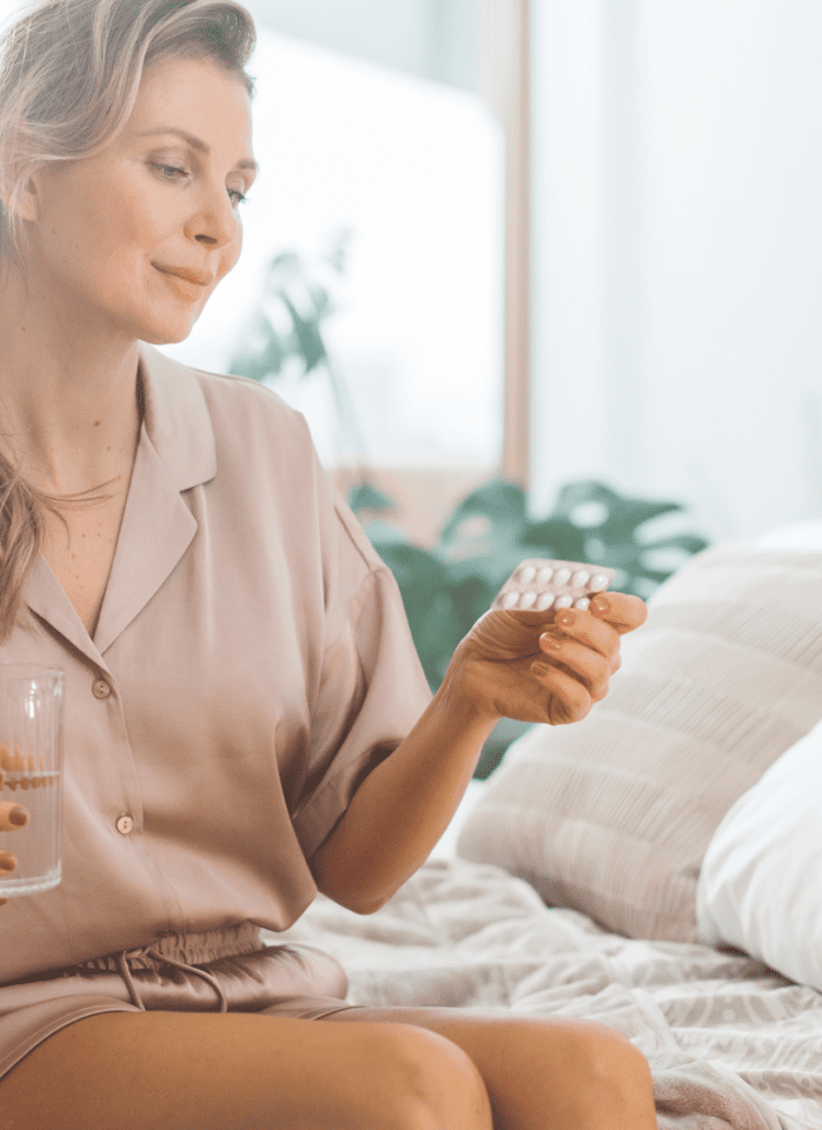 menopausal woman taking bioidentical hormone therapy pills BioTE therapy