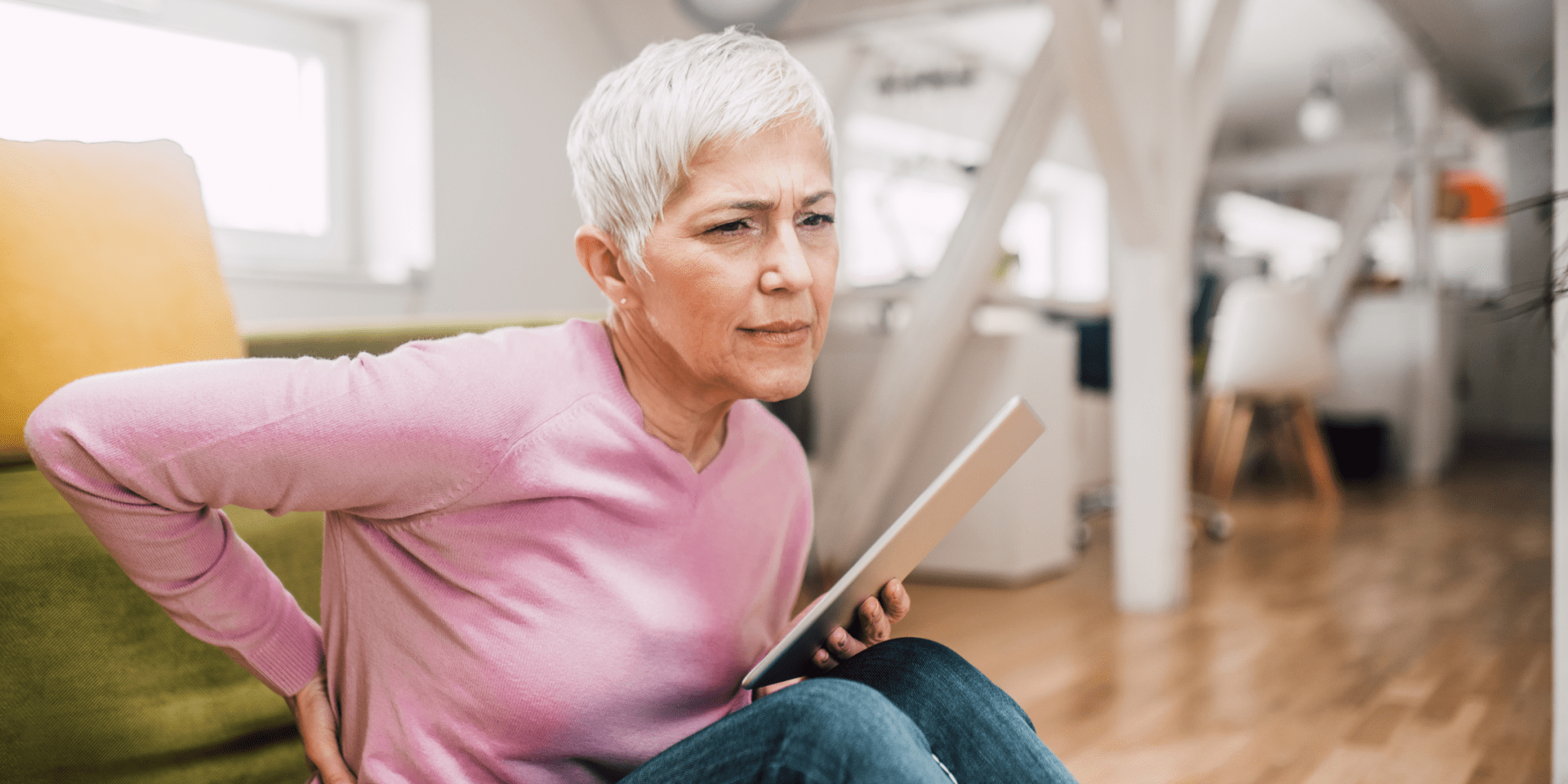 senior woman with arthritis in hands at doctor office