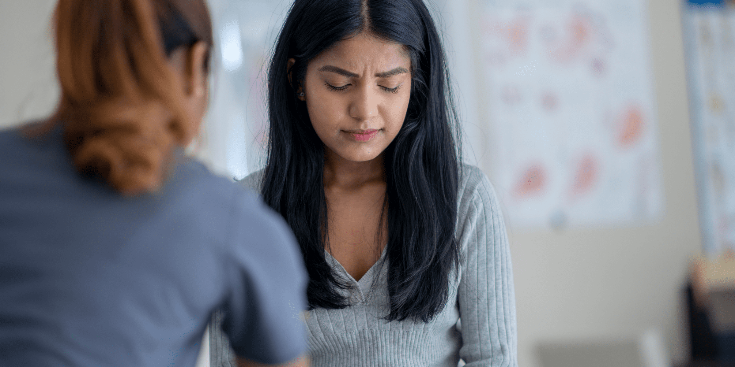 woman crying with therapist due to depression