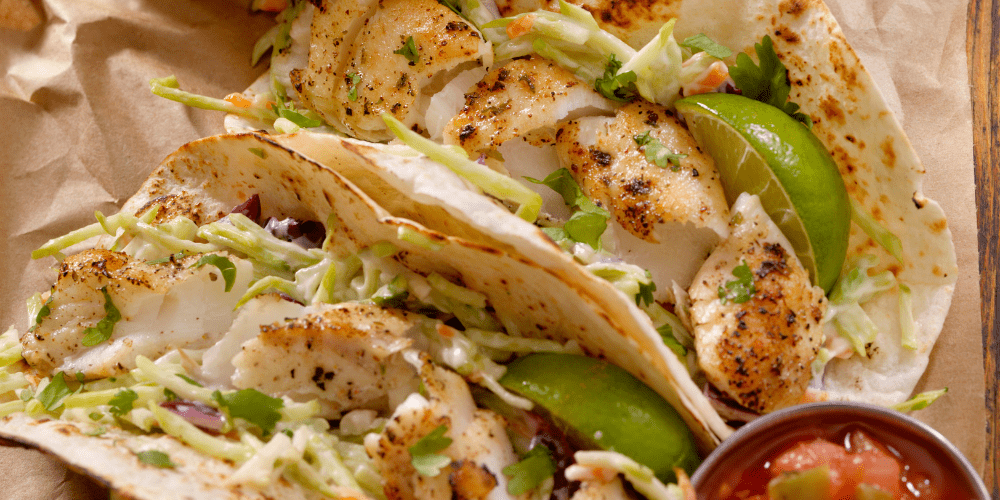 fish tacos with cabbage slaw and lime