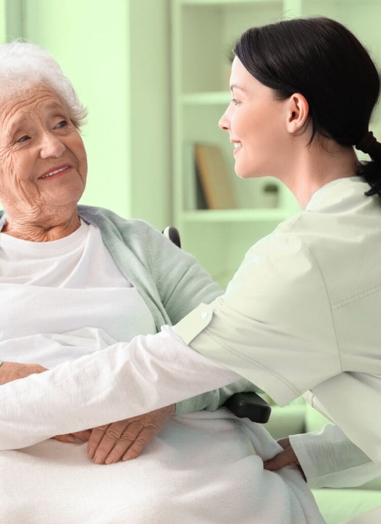 senior woman in a wheelchair being taken care of nurse in palliative care hospice