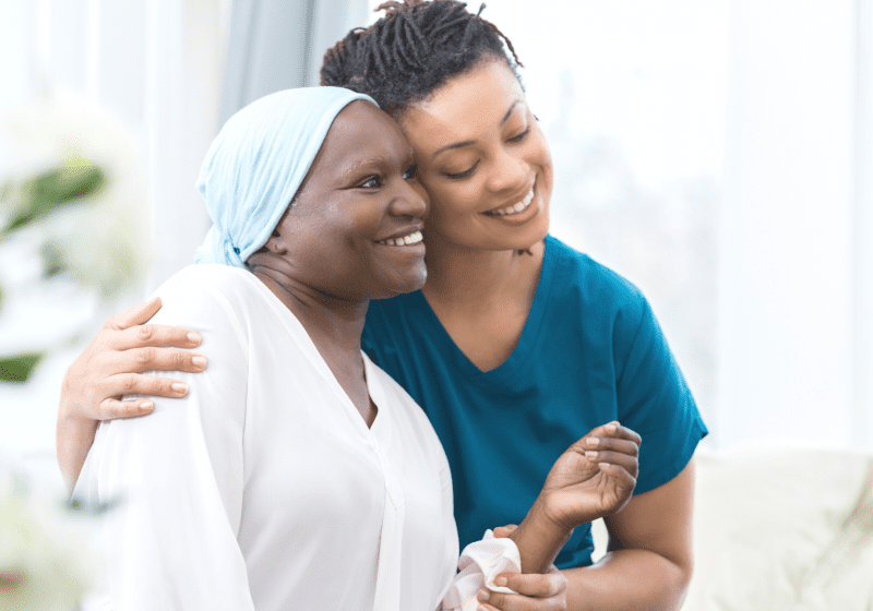 black nurse volunteering with refugee