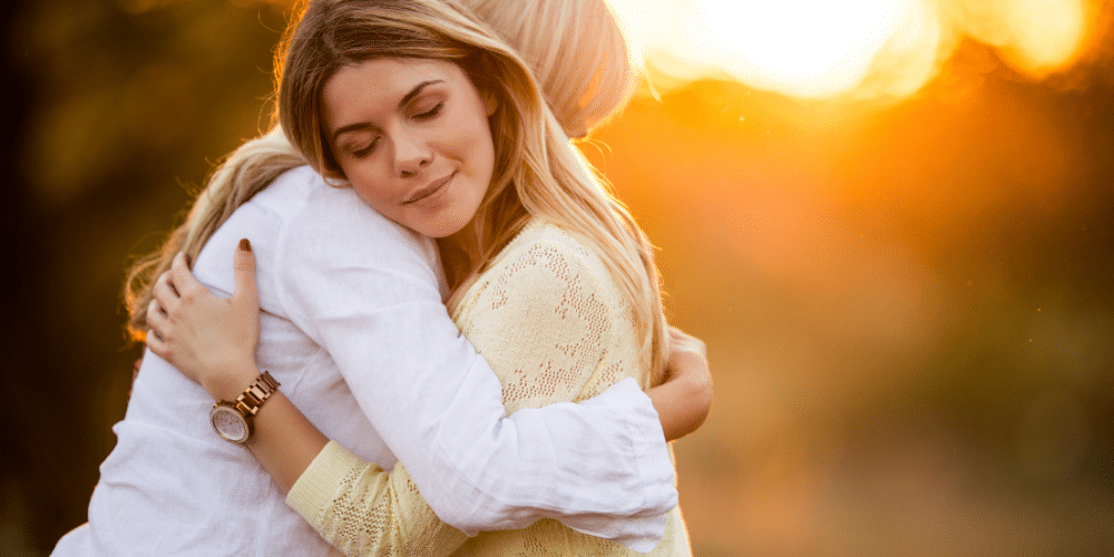 woman hugging her mother in sunset mental health good