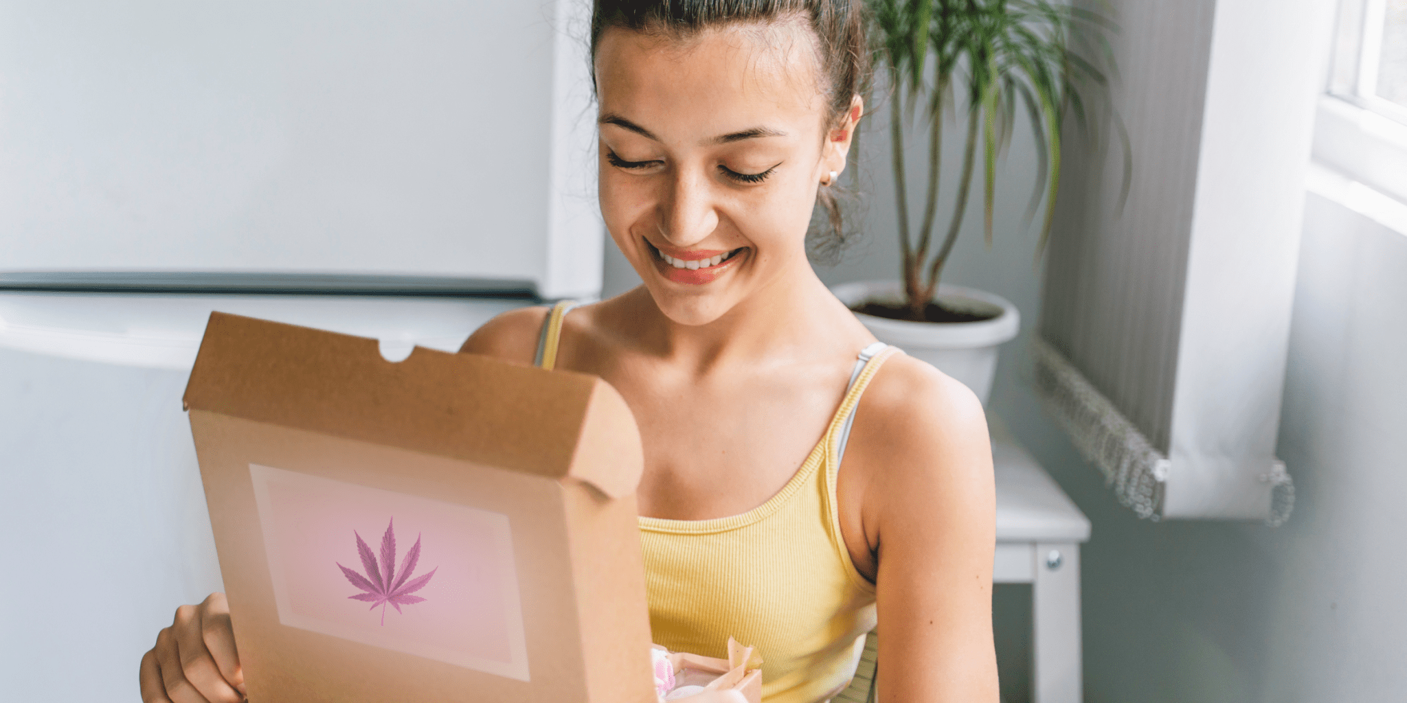 young woman opening up her Hemper cannabis subscription box