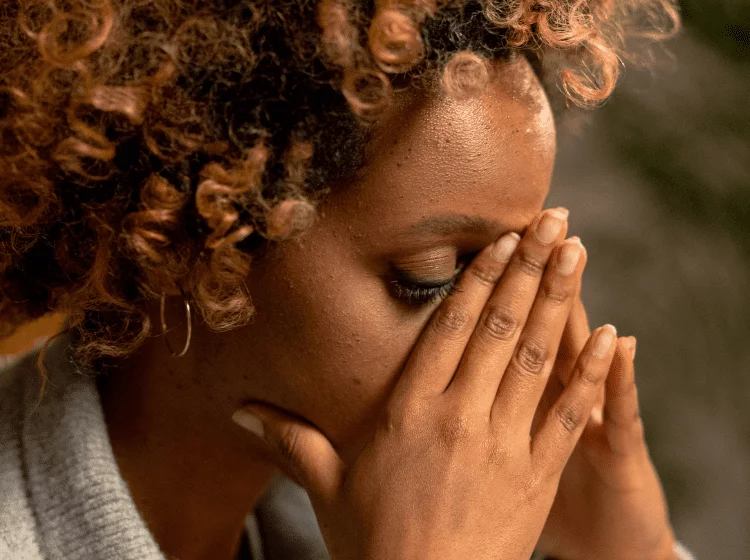 black woman stressed out needs cbd vape pen