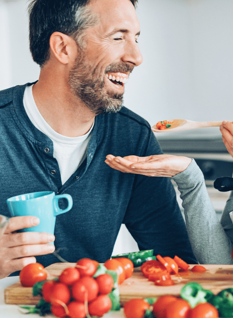 wife feeding husband over 50 healthy food