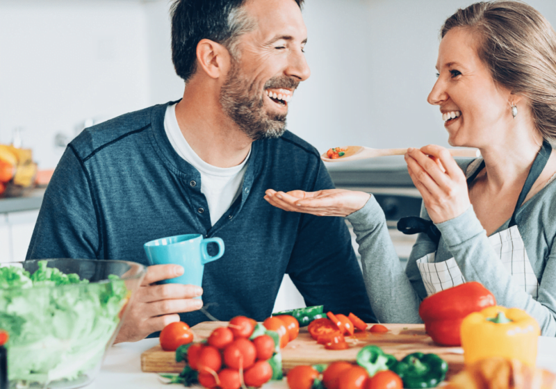 wife feeding husband over 50 healthy food