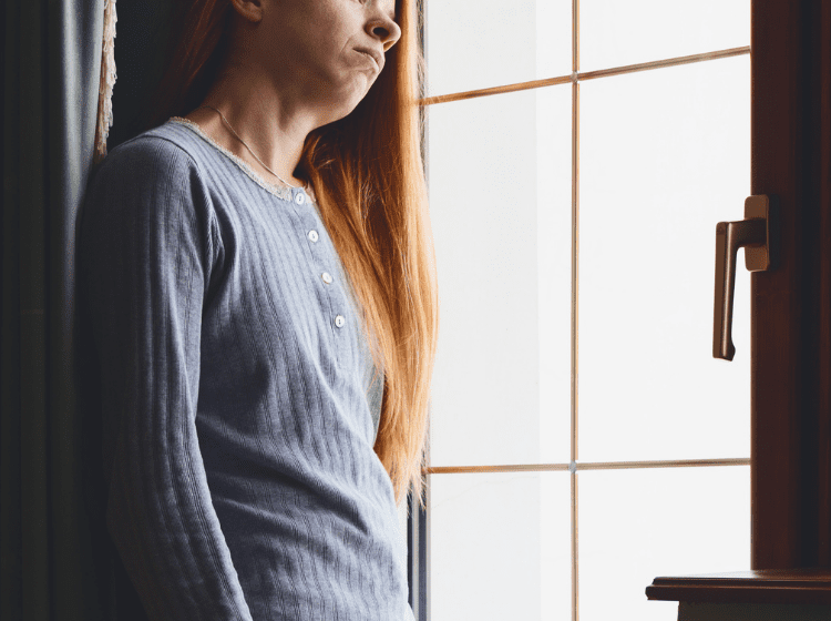 social anxiety women looking out the window covid lockdown