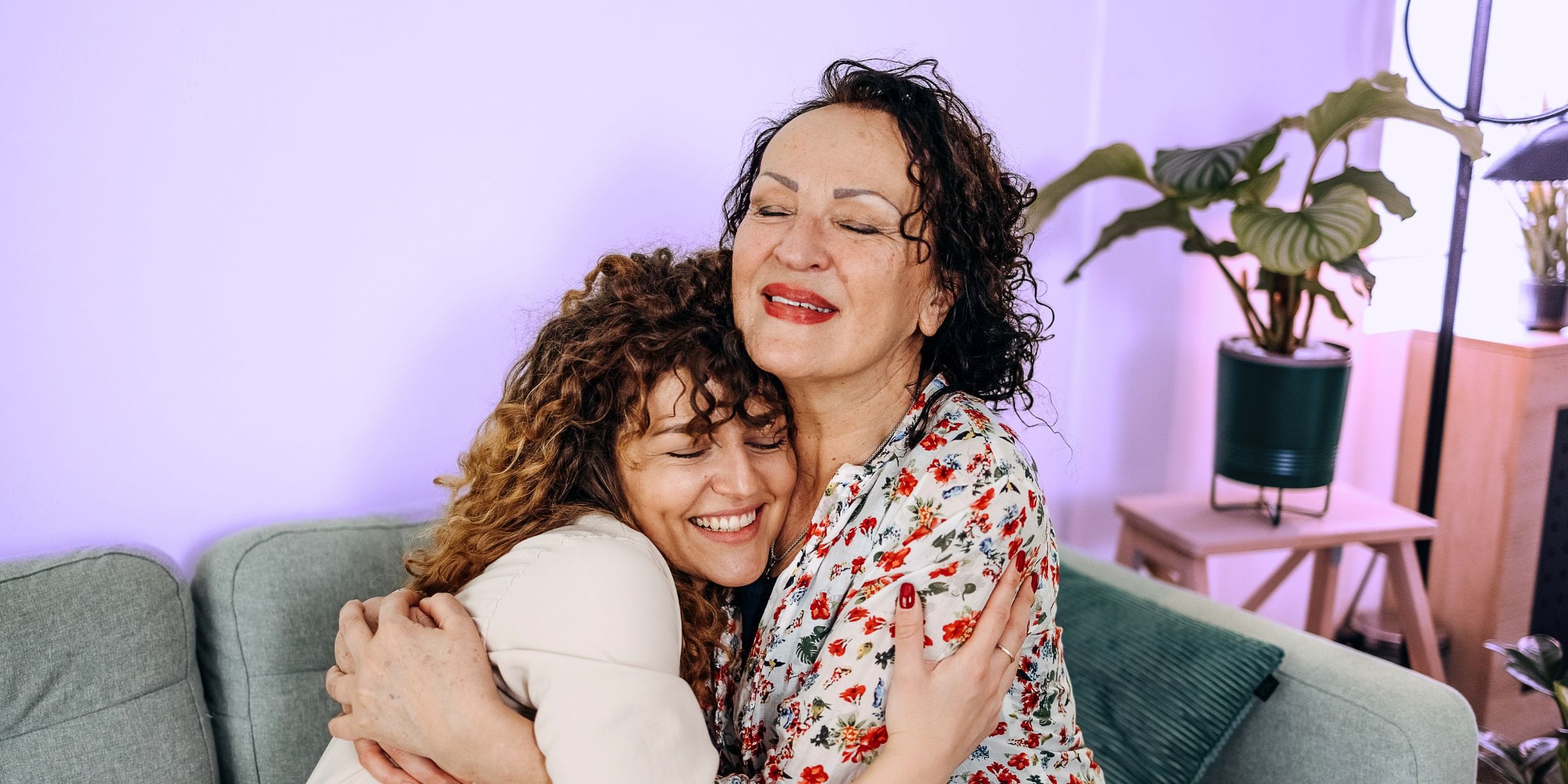 daughter hugging aging mother after conversation about elder care nursing home