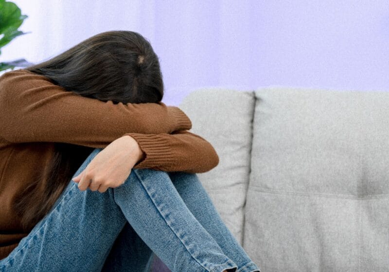 depressed woman hiding faced embarrassed recovering alcoholic