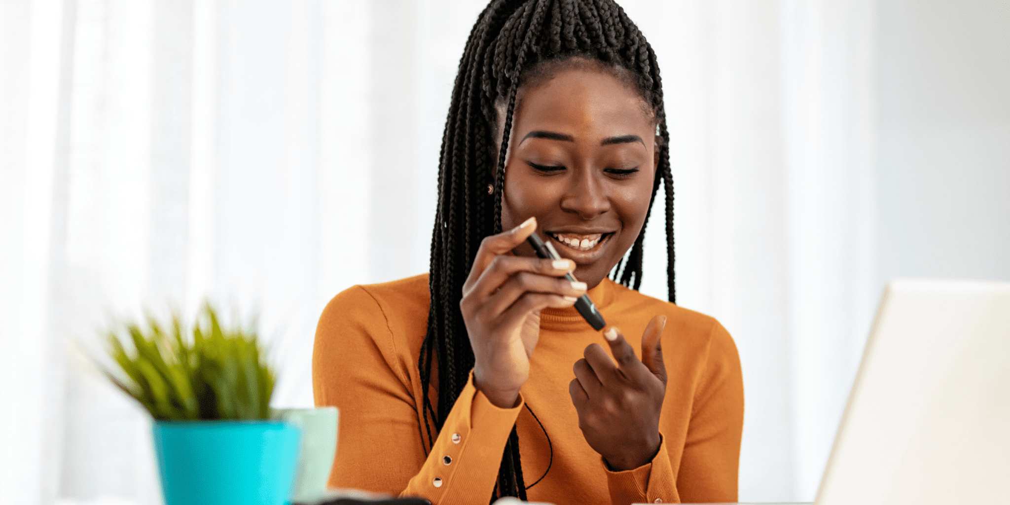 young black women with diabetes tests her blood sugar levels to manager peripheral artery disease