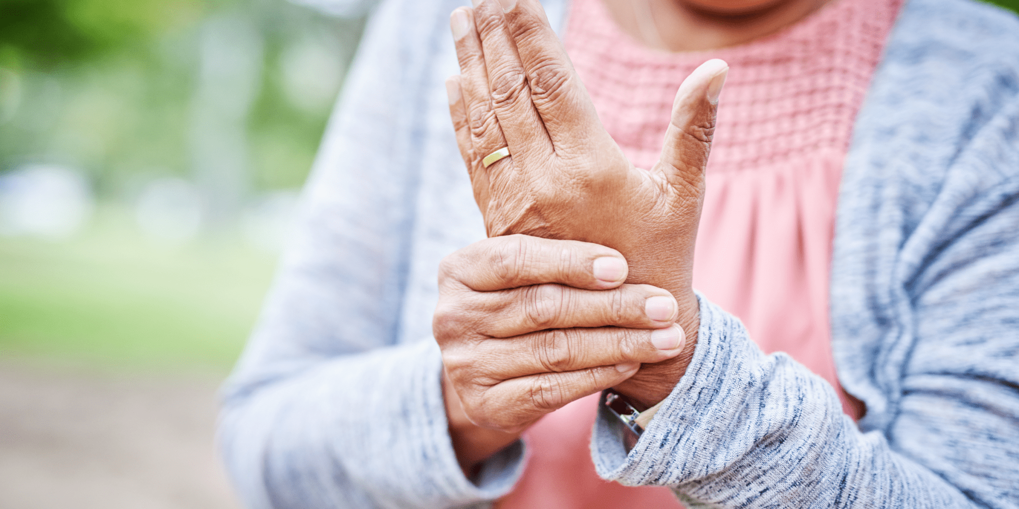 senior woman holding arthritis hand needs steroids for pain