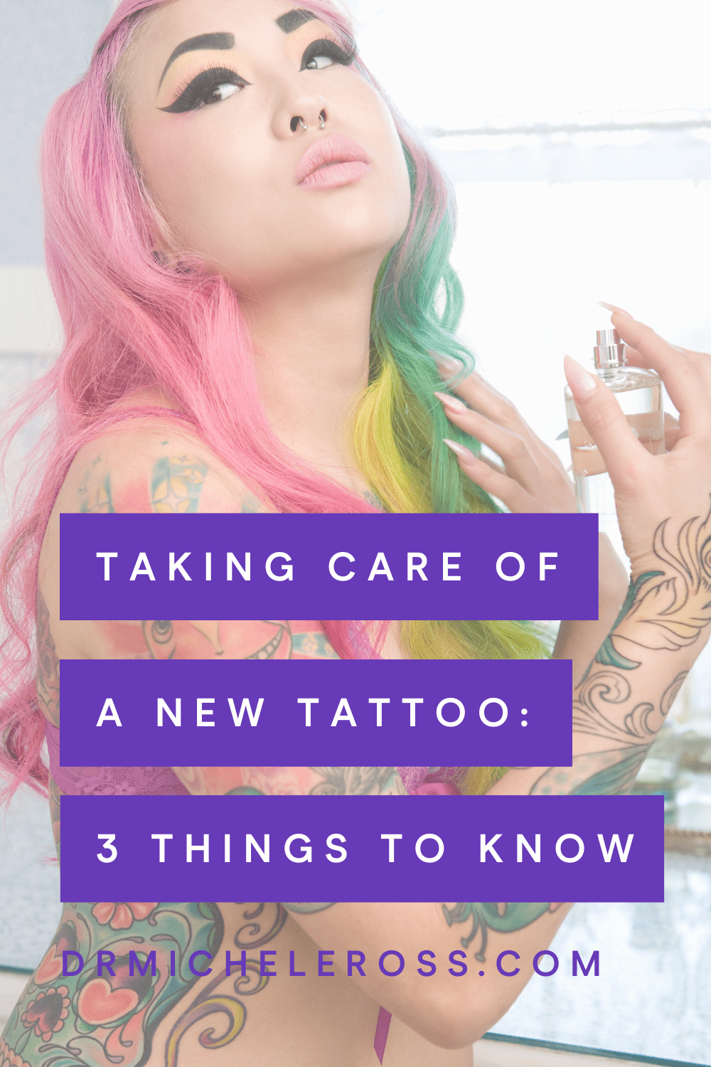 rainbow haired asian woman with tattoos caring for her skin with cbd tattoo care spray