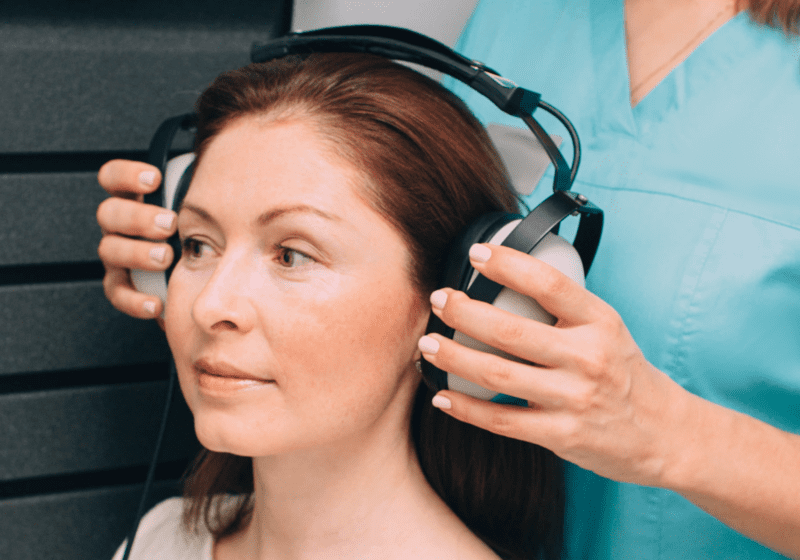 woman getting her hearing tested by audiologist