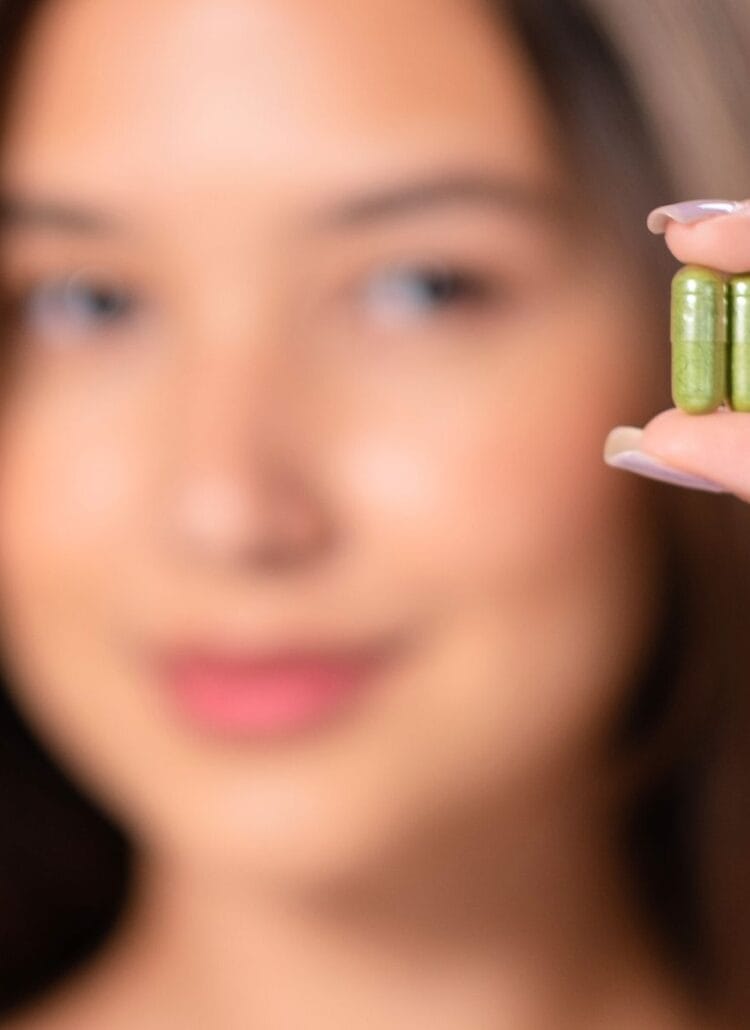 woman holding moringa pills latest nootropics for brain health