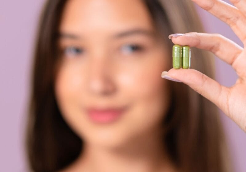 woman holding moringa pills latest nootropics for brain health