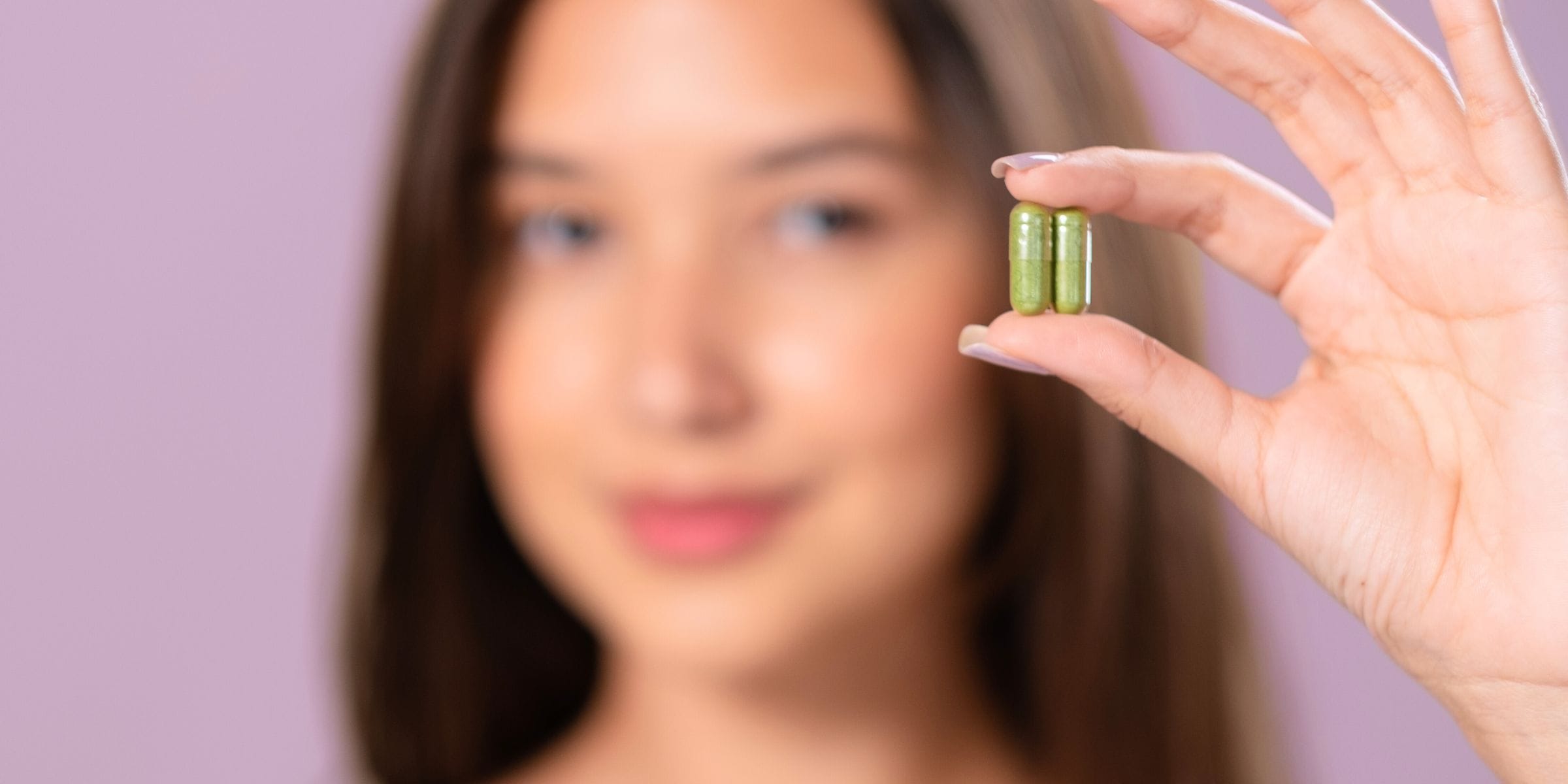 woman holding moringa pills latest nootropics for brain health