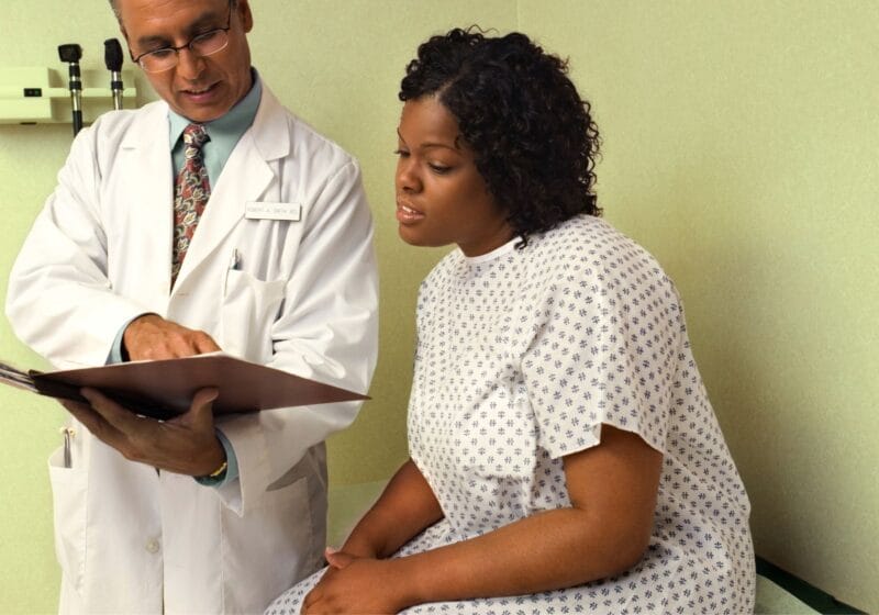 primary care doctor helping patients sustain her health through cholesterol management
