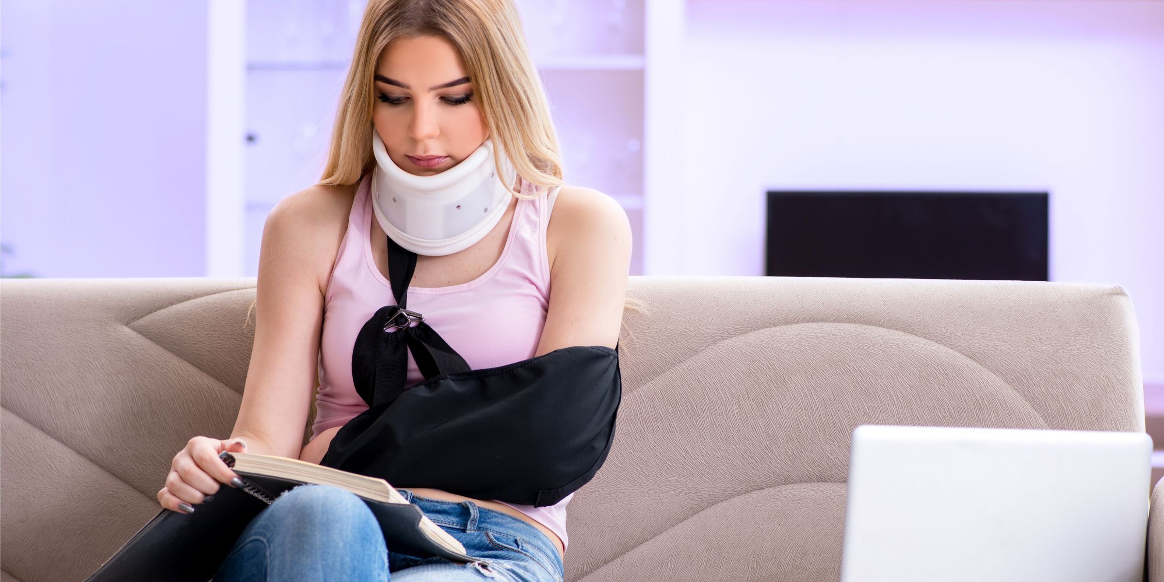 young woman in neck brace and arm cast injured recovering from car accident injury