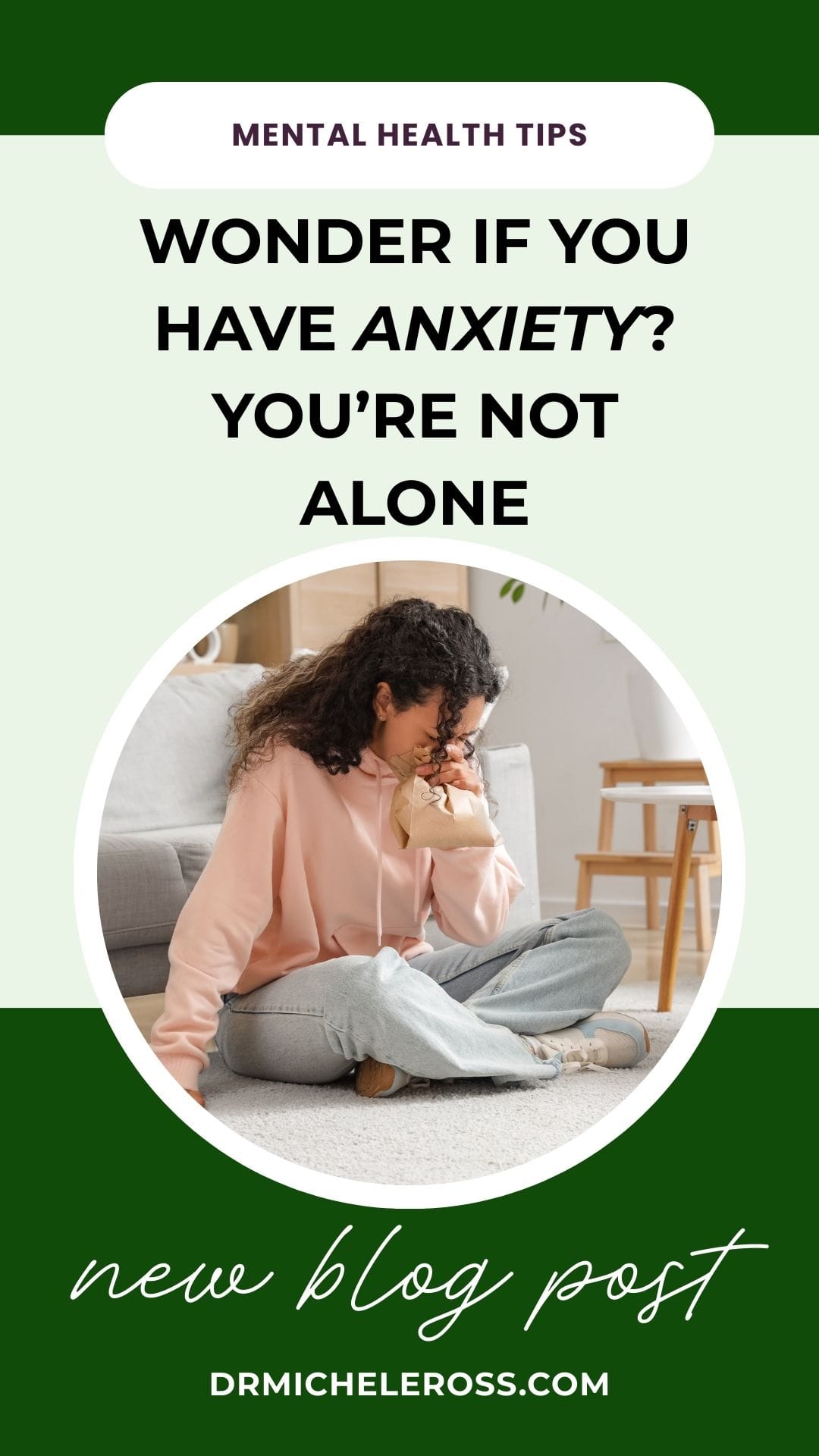 young woman with anxiety breathing into a paper bag having a panic attack