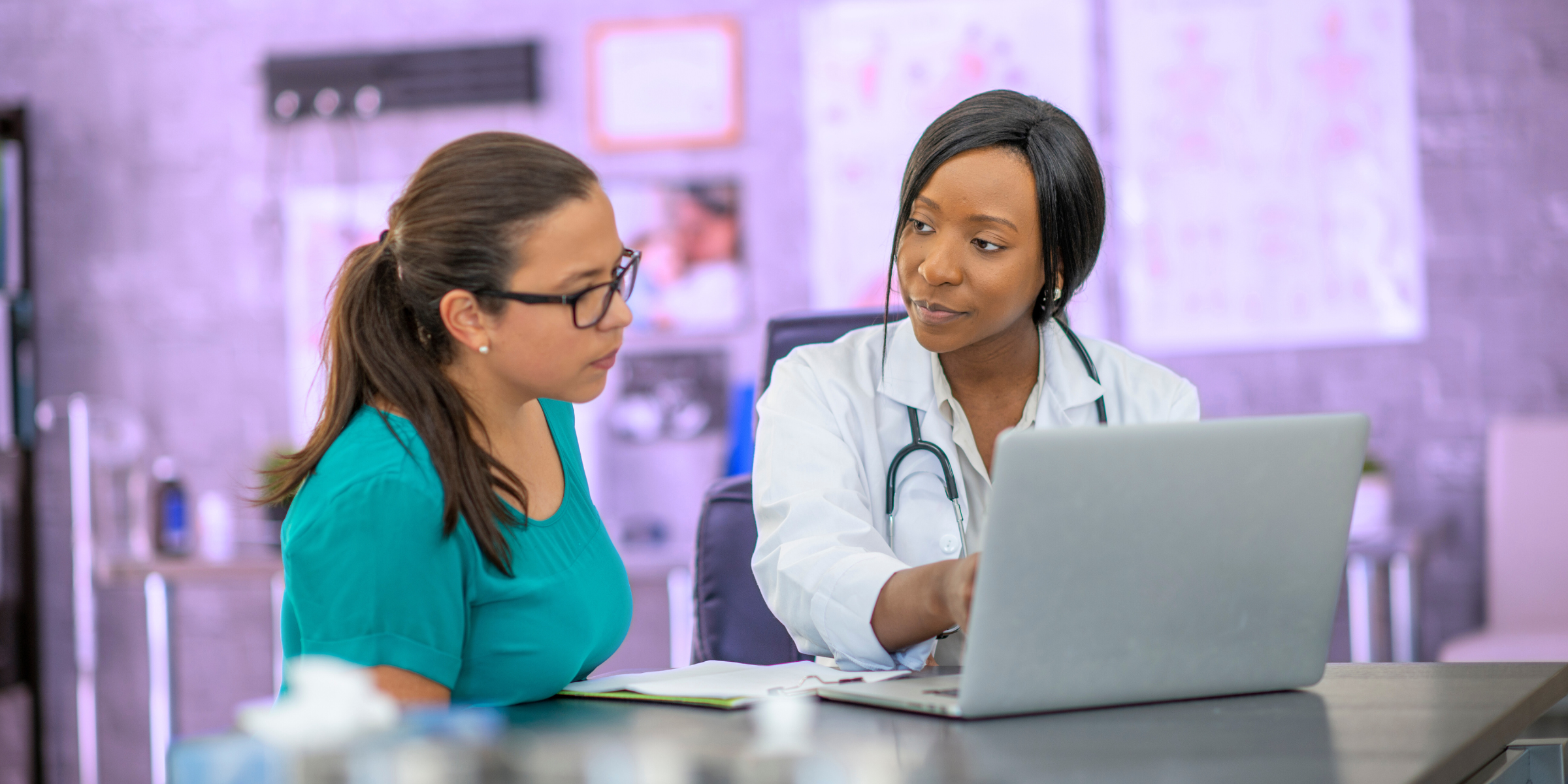 black doctor talking to female patient about change her health routines
