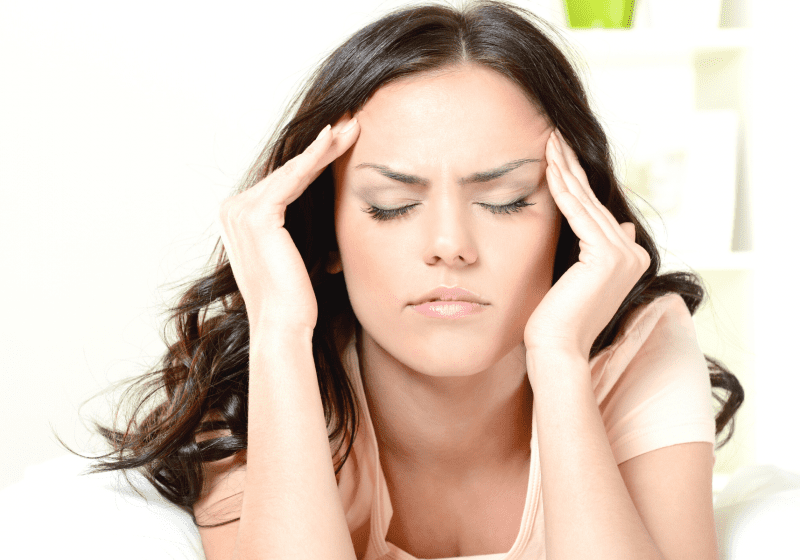 young woman with migraine headache