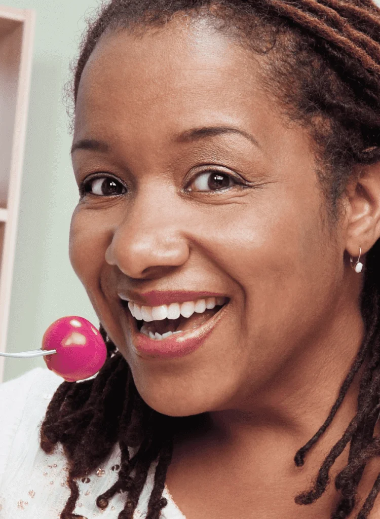 middle-aged black woman with diabetes eating healthy food tomato salad in kitchen