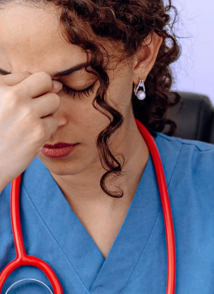 Female doctor stressed out stuck in a rut in a bad specialty